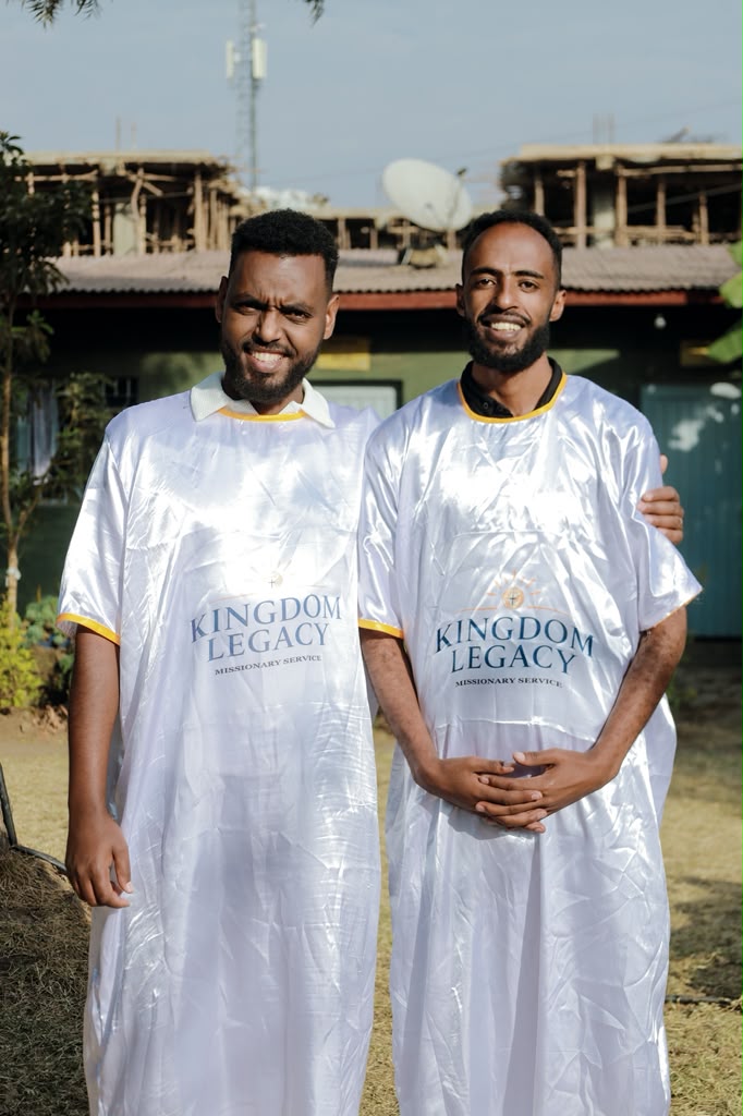 Two missionaries in Kingdom Legacy service robes